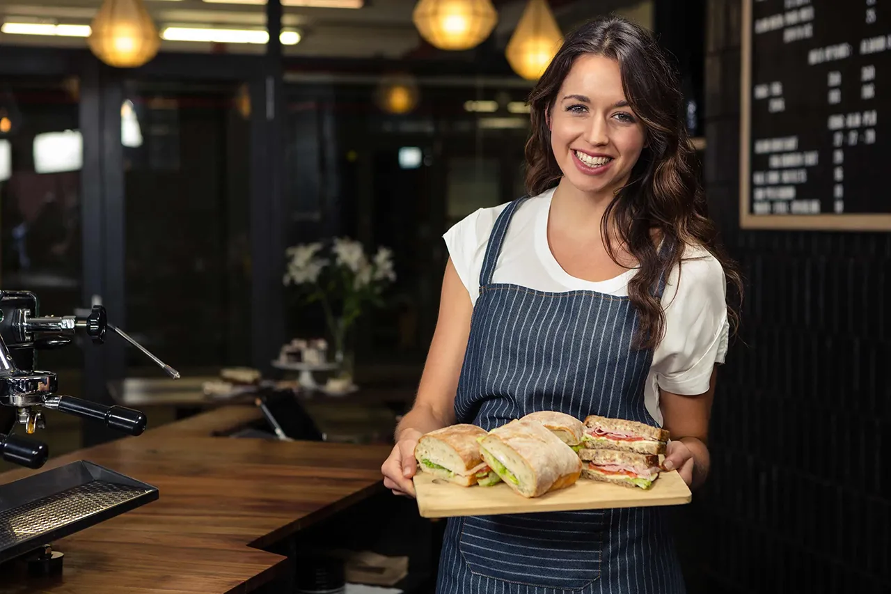 Female server with tray of sandwiches